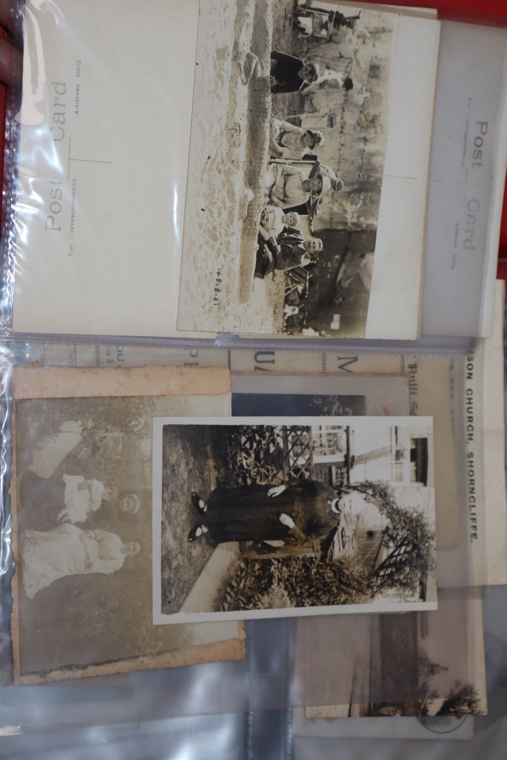 A collection of ephemera to include postcards, valentine and greetings cards, cigarette silks and cards tins, etc.